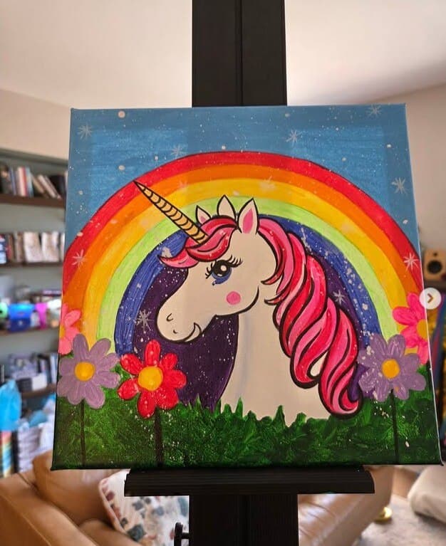 A colourful unicorn and rainbow acrylic painting on canvas, an example of the workshop's painting