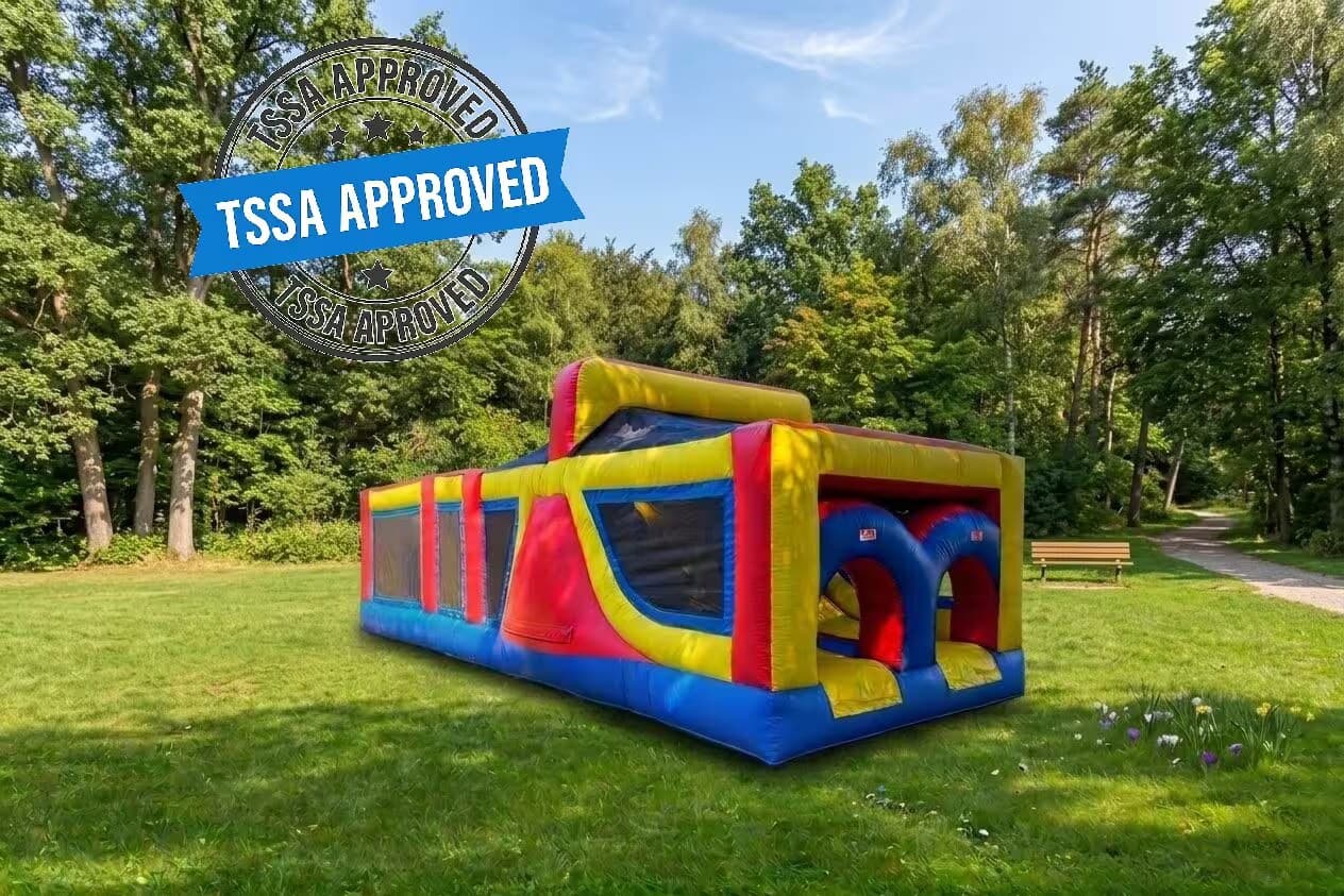 A 30-foot inflatable obstacle course bouncy house set up outdoors